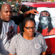 Kenneth and Jacquelyn Johnson stand next to a banner on their SUV showing their late son, Kendrick Johnson in Valdosta, Ga.